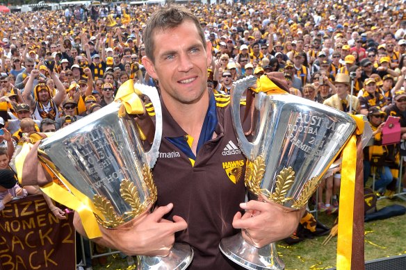 Luke Hodge with spoils from the Hawks’ golden era.