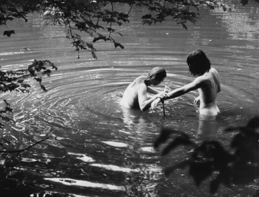 Skinny dipping in a nearby stream was the best way to keep clean during three days of rain, mud, heat and crowds.