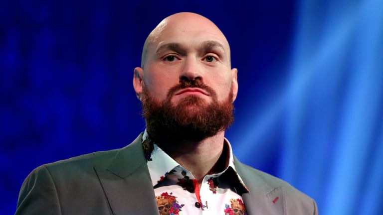 boxing tyson fury  give deontay wilder purse