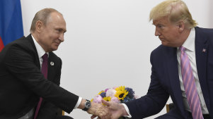 Russian President Vladimir Putin shakes hands with US President Donald Trump in 2019.