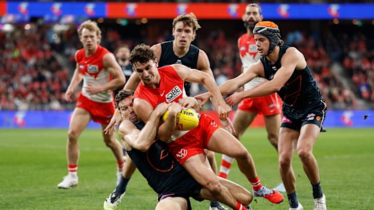 Toby Greene of the Giants tackles Sam Wicks of the Swans.