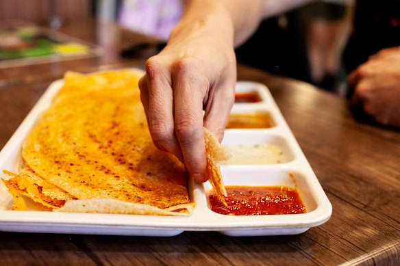 The thosai sets feature an assortment of boldly spiced vegetarian curries and chutneys.