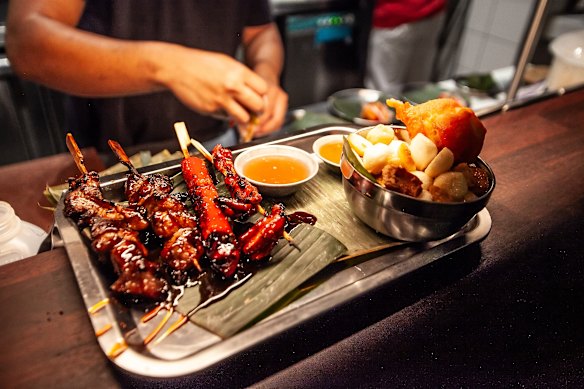 Tambay set featuring grilled skewers and a kwek-kwek deep-fried egg. 