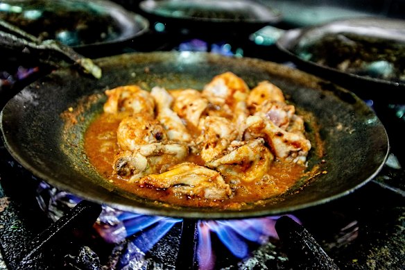 Chicken karahi on the stovetop.