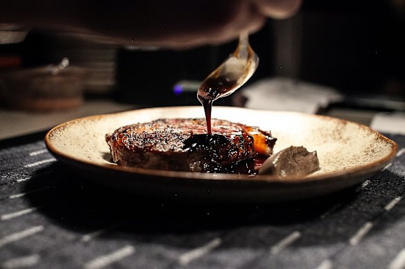 Black angus ribeye with mushroom puree and black garlic jus.