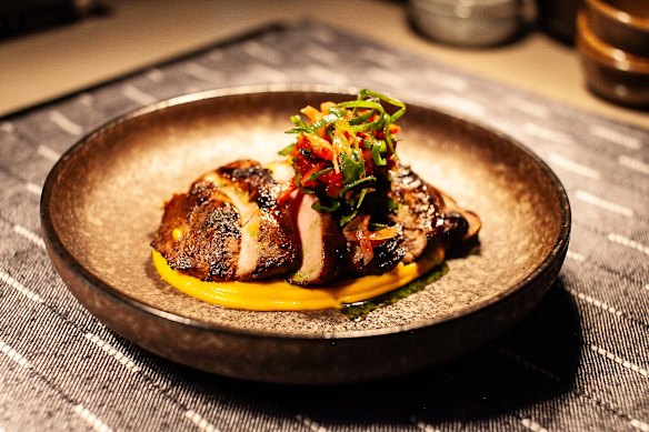 Pork scotch fillet on a pumpkin and coconuit puree with radish kimchi.