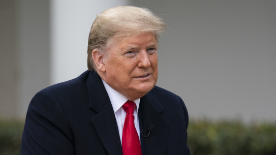 US President Donald Trump listens to a question during a Fox News virtual town hall with members of the coronavirus task force, in the Rose Garden at the White House.