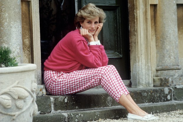 Diana, Princess of Wales (1961 - 1997) sitting on a step at her home, Highgrove House, in Doughton, Gloucestershire, 18th July 1986.