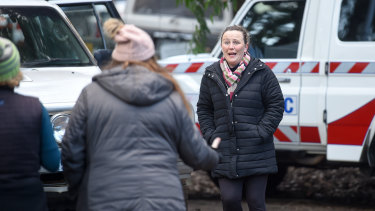 Penny Callaghan greets friends after finding out her son had been found. 