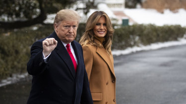 US President Donald Trump and first lady Melania Trump walk towards Marine One at the start of the weekend.