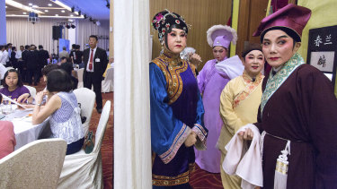 Members of the Nam Hwa Opera, a Teochew opera group, get ready for a performance in Singapore in May at a club for Singaporeans with ties to China's Guangdong Province.