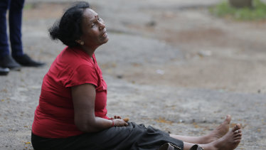 A relative of a blast victim grieves outside a morgue in Colombo, Sri Lanka.