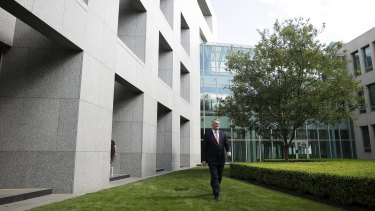 Minister for Finance Mathias Cormann arrives to address the media discussing the economic response to the pandemic, during a press conference at Parliament House in Canberra on Thursday.