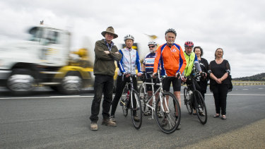 Residents Ross Hampton and Pauline Thorn, cyclists Peter Granleese and Glenn Cocking, John Thorn, Susan Butt and Wendy O'Dea, who are calling for cycle lanes to be included in plans for the Barton Highway duplication.