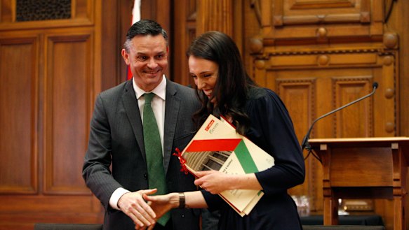 New Zealand Green Party leader James Shaw, left, and Prime Minister-designate Jacinda Ardern shake hands after signing a confidence and supply agreement in 2017.