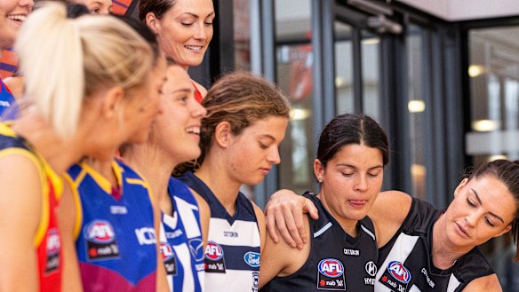 AFLW players attend a launch last year of a four-year broadcast deal with Foxtel and Seven.