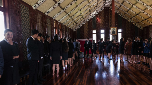 Students gather for a Maori welcoming ceremony at Hoani Waititi Marae, the communal hall in Auckland.