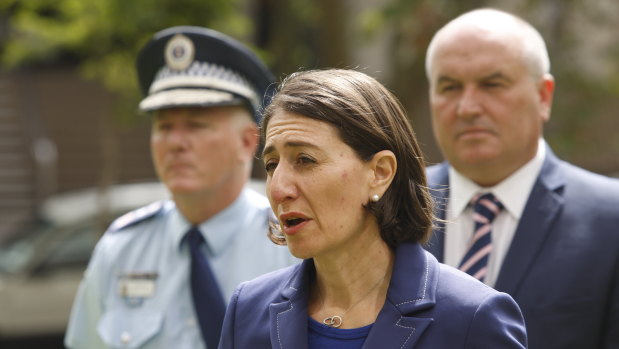 The Premier, Commissioner Fuller and Minister for Police and Emergency Services David Elliott during a press conference at the height of the pandemic. 