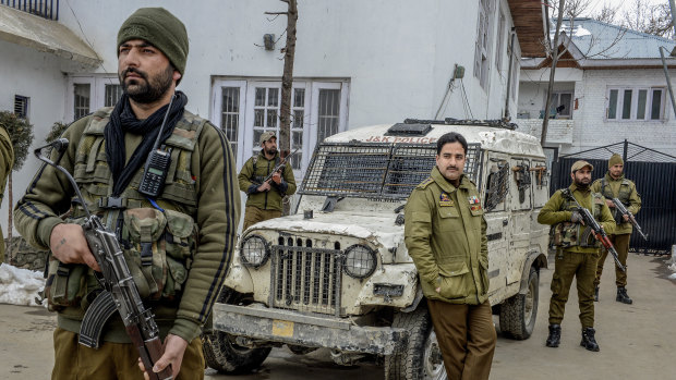 Officer Ashiq Tak, centre, with his bodyguards outside his office in Shopian, India, in the state of Kashmir. As the commanding officer of a tactical police unit in southern Kashmir, he is one of hundreds of thousands fighting a tiny but dedicated insurgency.