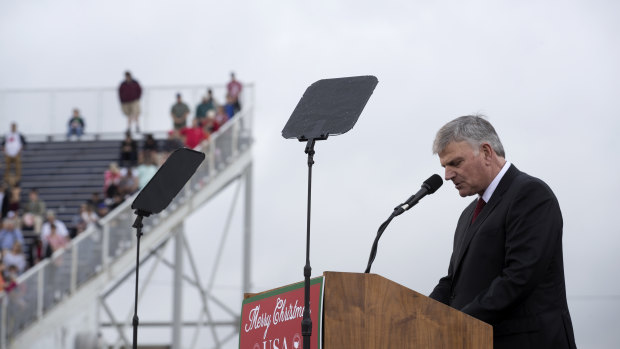 Franklin Graham, Billy Graham's son, leads the audience in prayer at a rally for US President Donald Trump  in December 2016.