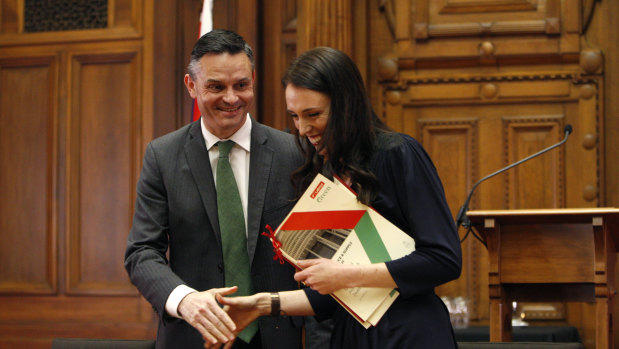 New Zealand Green Party leader James Shaw, left, and Prime Minister-designate Jacinda Ardern shake hands after signing a confidence and supply agreement in 2017.