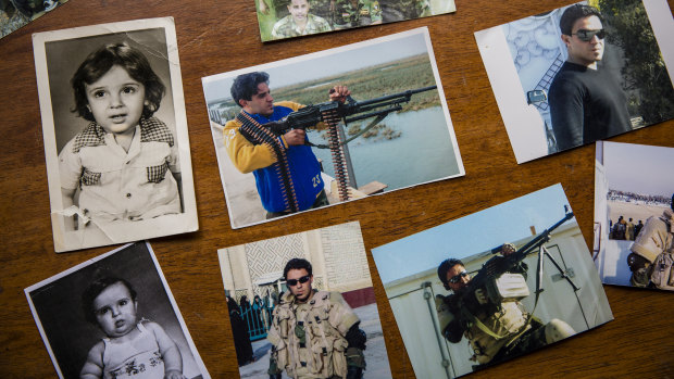 Photographs of Captain Harith al-Sudani are laid out at his family's home in Baghdad.