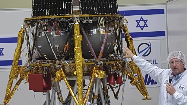 Opher Doron, general manager of Israel Aerospace Industries' space division, speaks beside the SpaceIL lunar module, during a press tour of their facility near Tel Aviv, Israel in July.