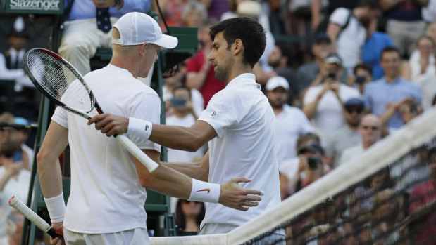 Kyle Edmund congratulates Novak Djokovic after their match.
