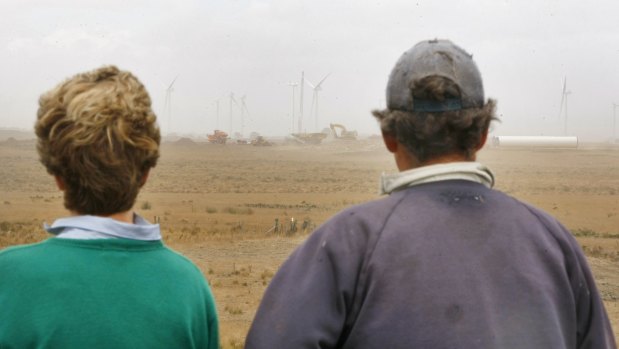 Ann and Gus Gardner watching on in March 2012 as construction of the Macarthur Wind Farm takes place next to their land.