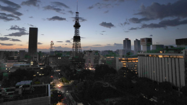 Sapporo TV Tower, centre, and other buildings lose power after an earthquake in northern Japan,