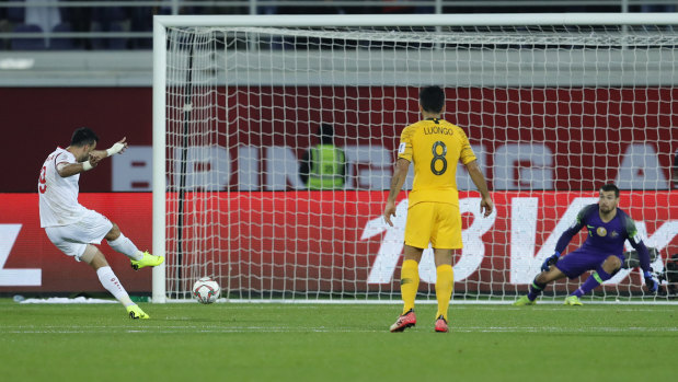 Out of nowhere: Omar Al Somah converts the contentious penalty awarded to Syria against the Socceroos.
