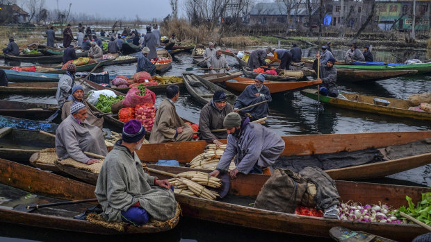 Vendors at a floating market in Srinigar, India, in the state of Kashmir. 
