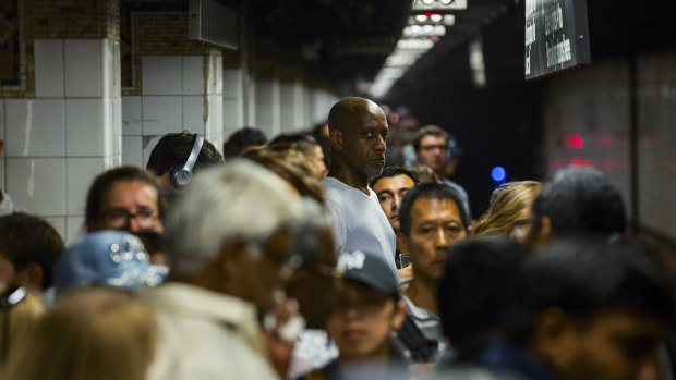 Passengers crowd the subway station on New York's Lexington Ave line, the most crowded subway line in the nation.