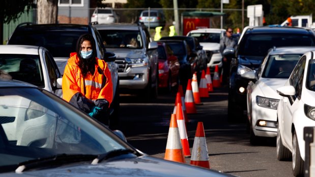 Cars queued for nearly a kilometre to attend a pop-up mobile clinic in Victoria Park, Picton. 