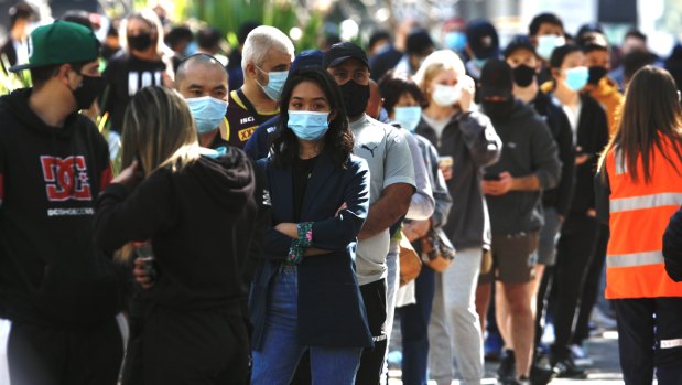 People line up to be vaccinated at the Sydney Olympic Park hub.  