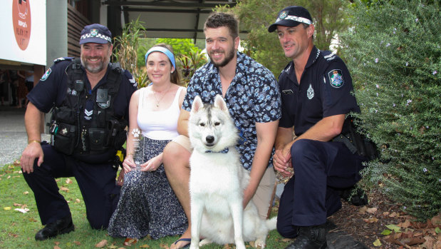 Max with owners David Symes and Shaune Martin, and the first police respondents to the scene.