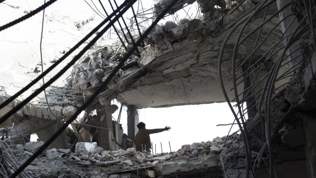 The aftermath of an air strike that killed seven people in Sanaa in September 2015.