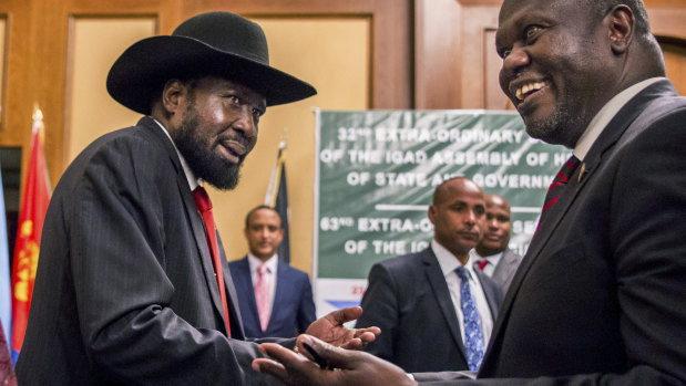 South Sudan's President Salva Kiir and opposition leader Riek Machar shake hands during peace talks in Addis Ababa, Ethiopia in June.