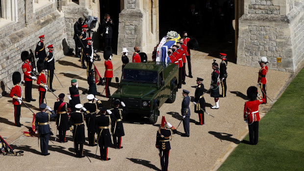 Prince Philip’s coffin is loaded onto the specially modified Land Rover. 
