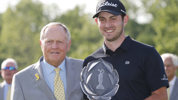Tournament host Jack Nicklaus presents record-breaker Patrick Cantlay with the trophy.