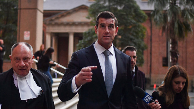 Bruce McClintock, SC, left, with Ben Roberts-Smith outside court last week.