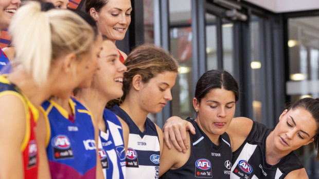 AFLW players attend a launch last year of a four-year broadcast deal with Foxtel and Seven.