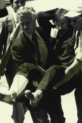 The 1977 capture of Edwin John Eastwood, seen here being carried from a plane at Essendon Airport, enhanced Miller's reputation.