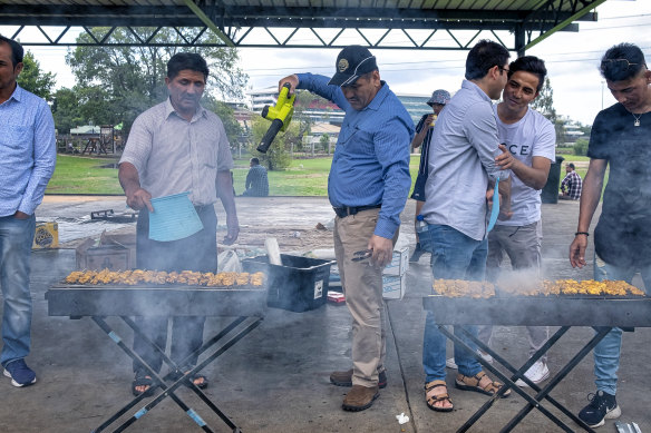 A law of the Australian barbecue: men must cook the meat: in this case, kebabs.