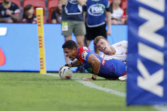 Dane Gagai scores for the Newcastle Knights against the Dolphins.