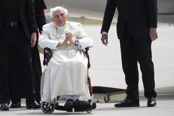 In this June 22, 2020 photo Emeritus Pope Benedict XVI arrives for his departure at Munich Airport in Freising, Germany. 