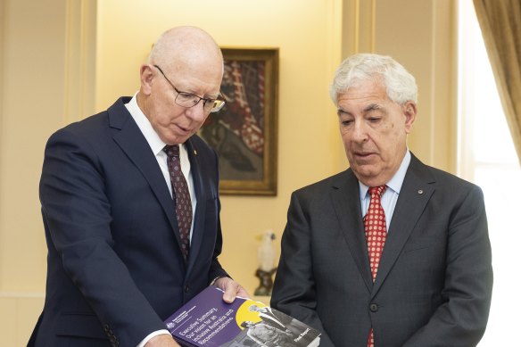 Governor-General David Hurley receives the final report by the Royal Commission into Violence, Abuse, Neglect and Exploitation of People with Disability, from Ronald Sackville, chair of the royal commission.