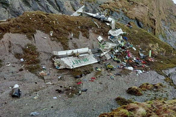 This photo released by Fishtail Air, shows the wreckage of a plane in a gorge in Sanosware in Mustang district close to the mountain town of Jomsom, west of Kathmandu, Nepal on Monday, May 30.