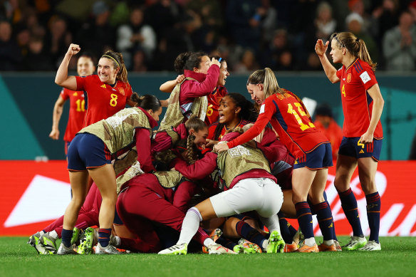 The Spanish team celebrate Olga Carmona’s goal during Sunday’s Grand Final. 