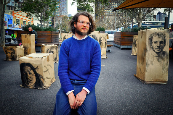 Daniel Coulson and his street art at the Queen Victoria Market on Saturday.